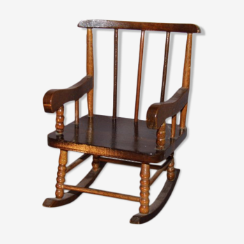 Small rocking decorative chair with bars