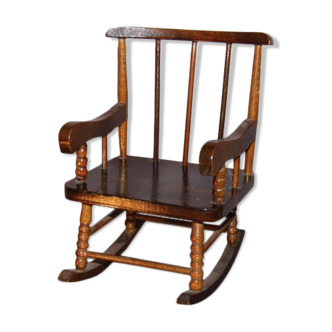 Small rocking decorative chair with bars