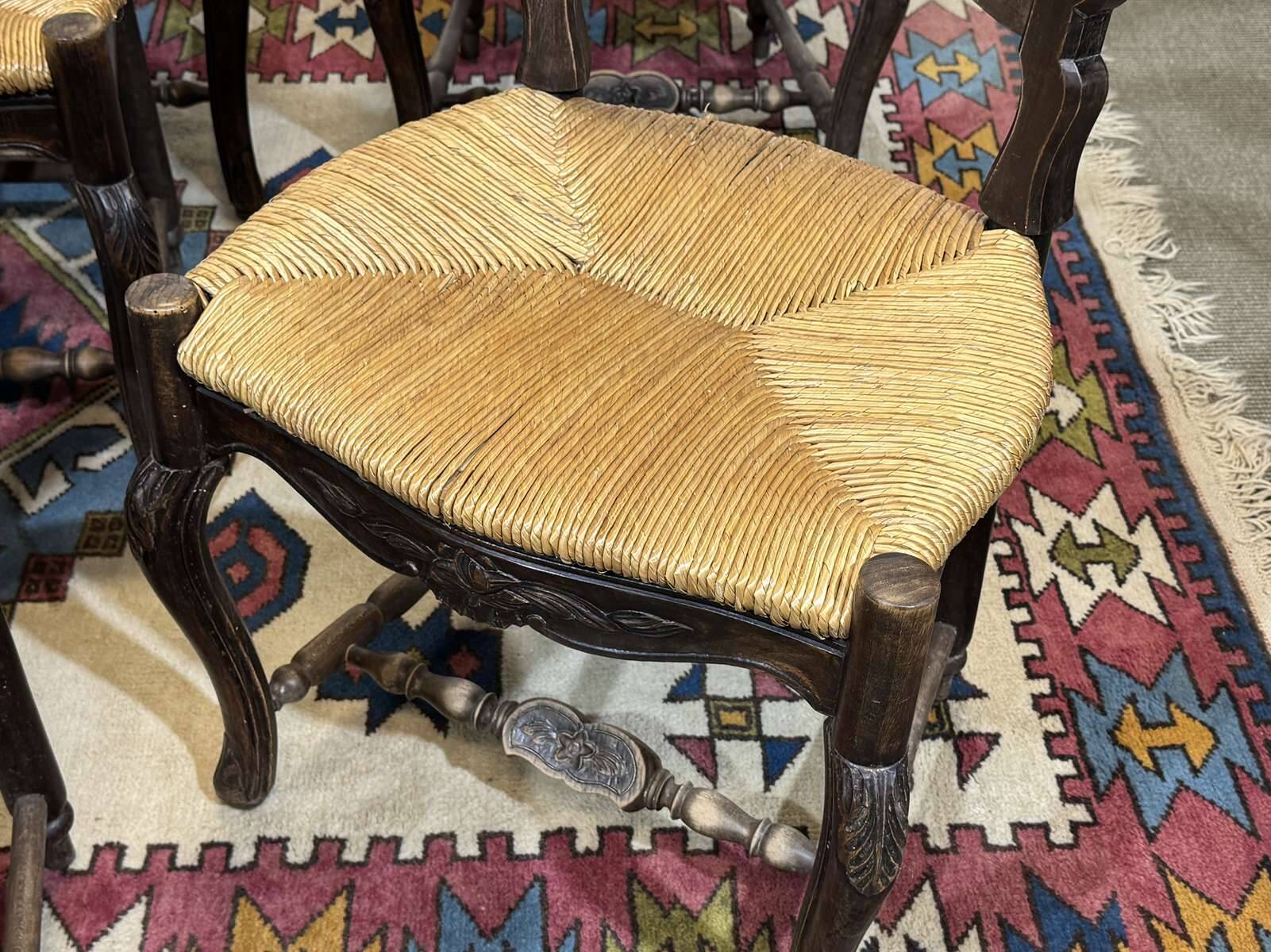 Set of 7 Louis XV style beech chairs with straw seats.