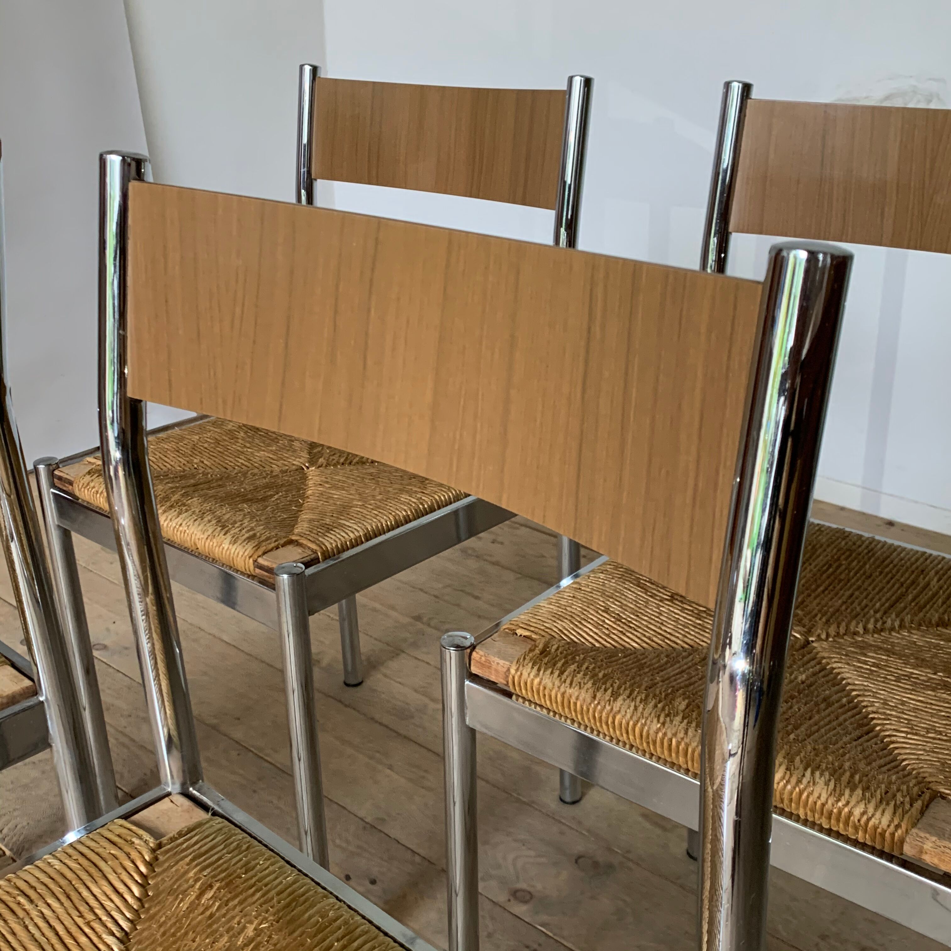 4 chrome and straw chairs