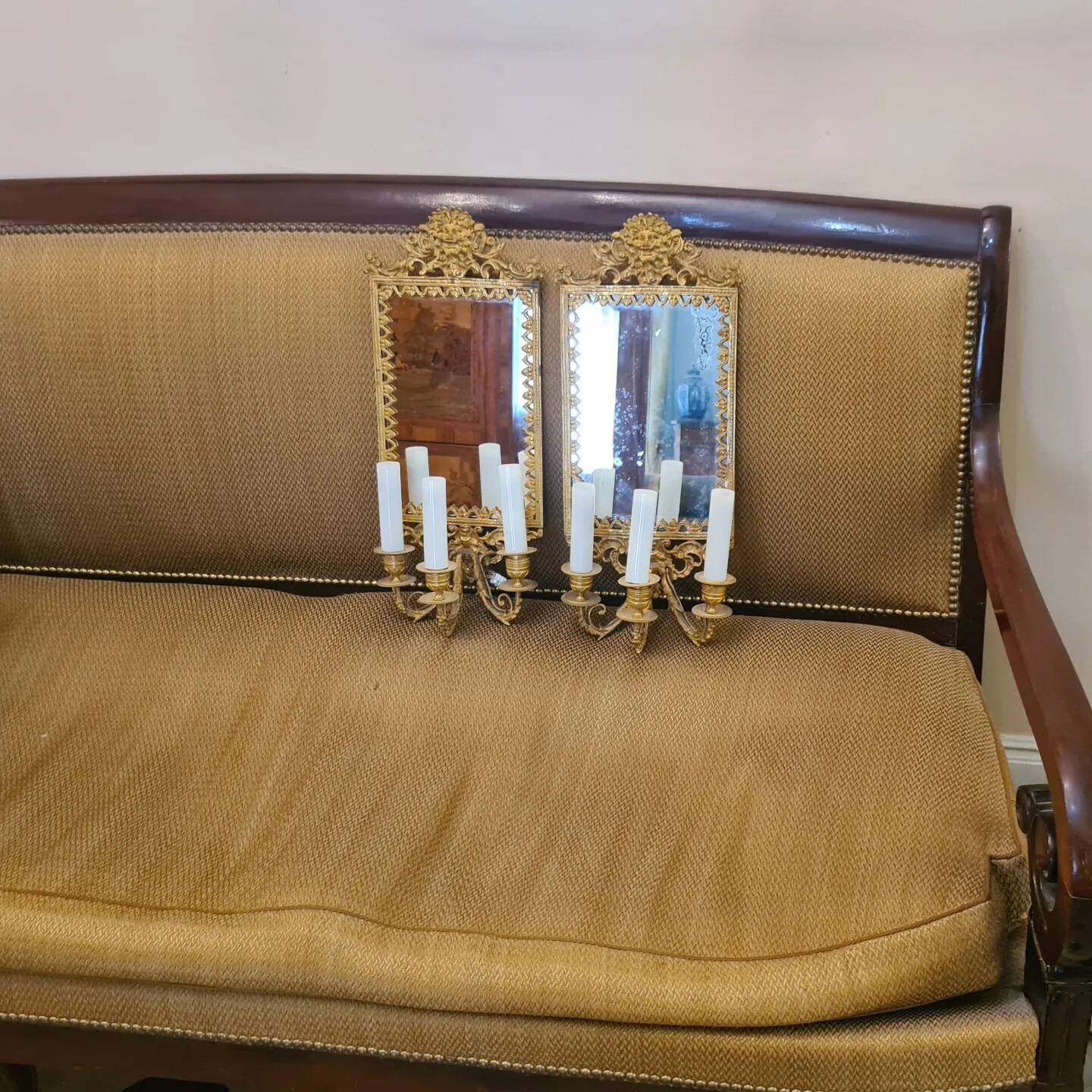 Pair of wall lights with mirror backgrounds with 3 arms of lights in chiseled and gilded bronze. framing decorated with foliage and masks. louis xiv style
