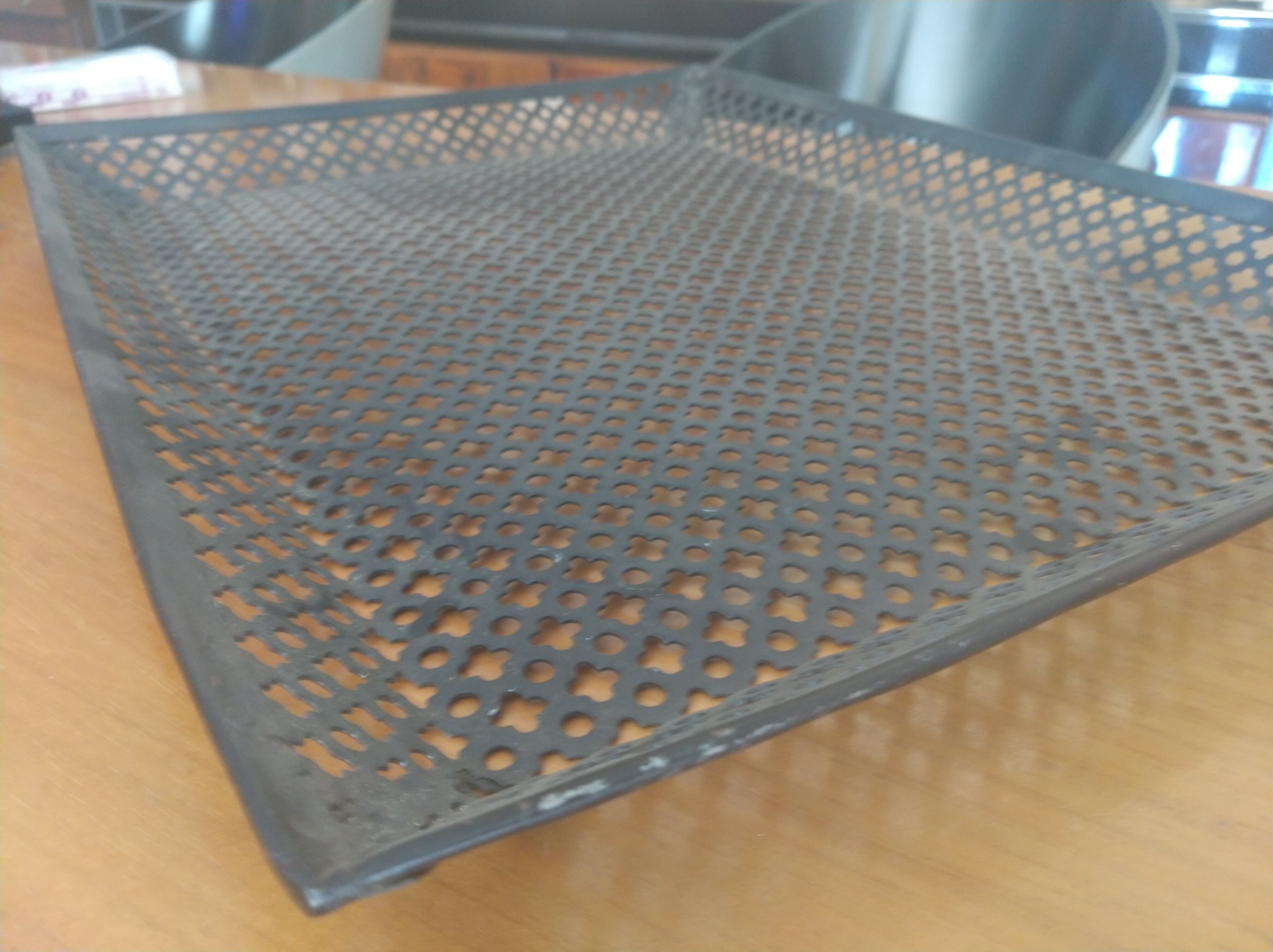 Perforated sheet metal tray, circa 1950