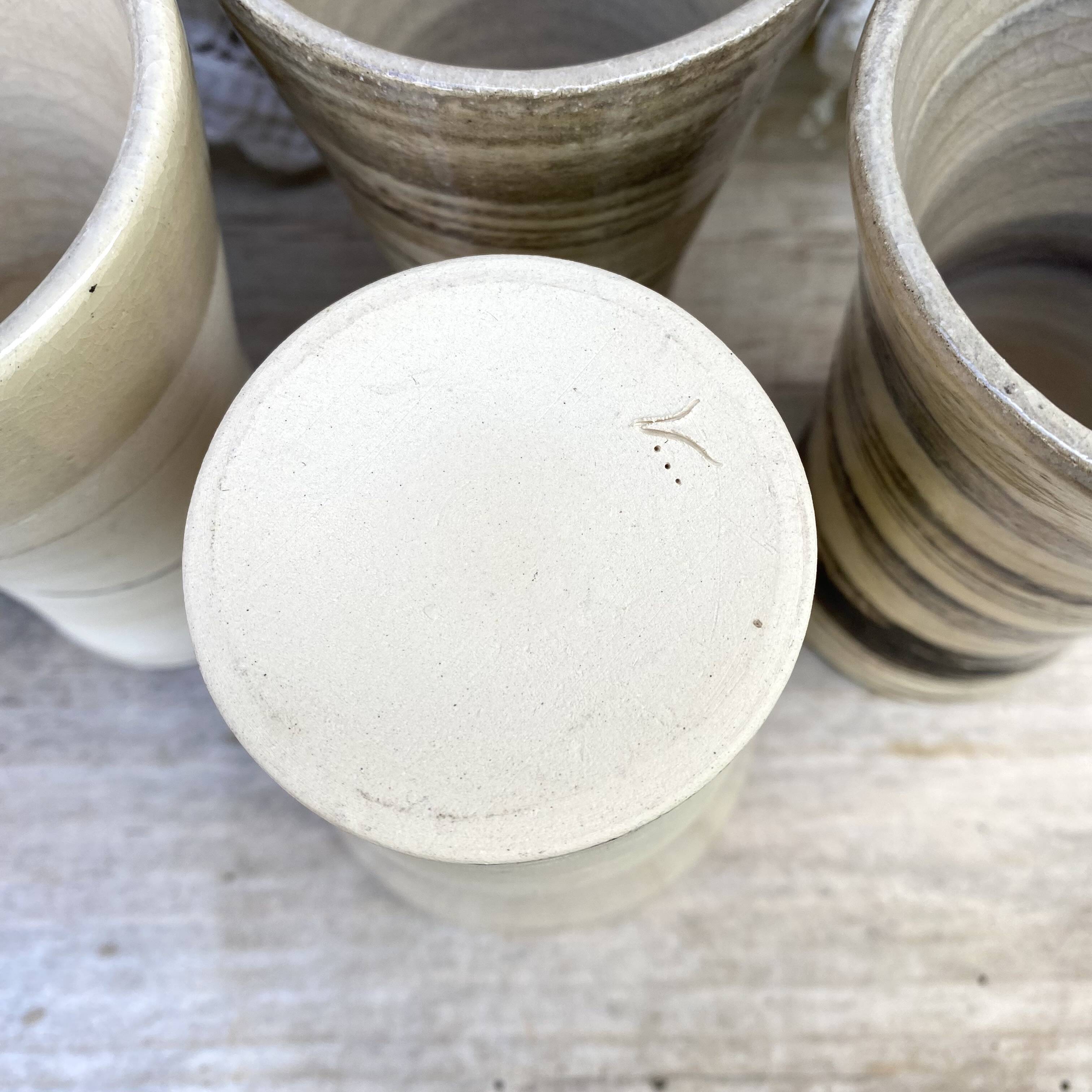High ceramic cups made of mixed clay.
