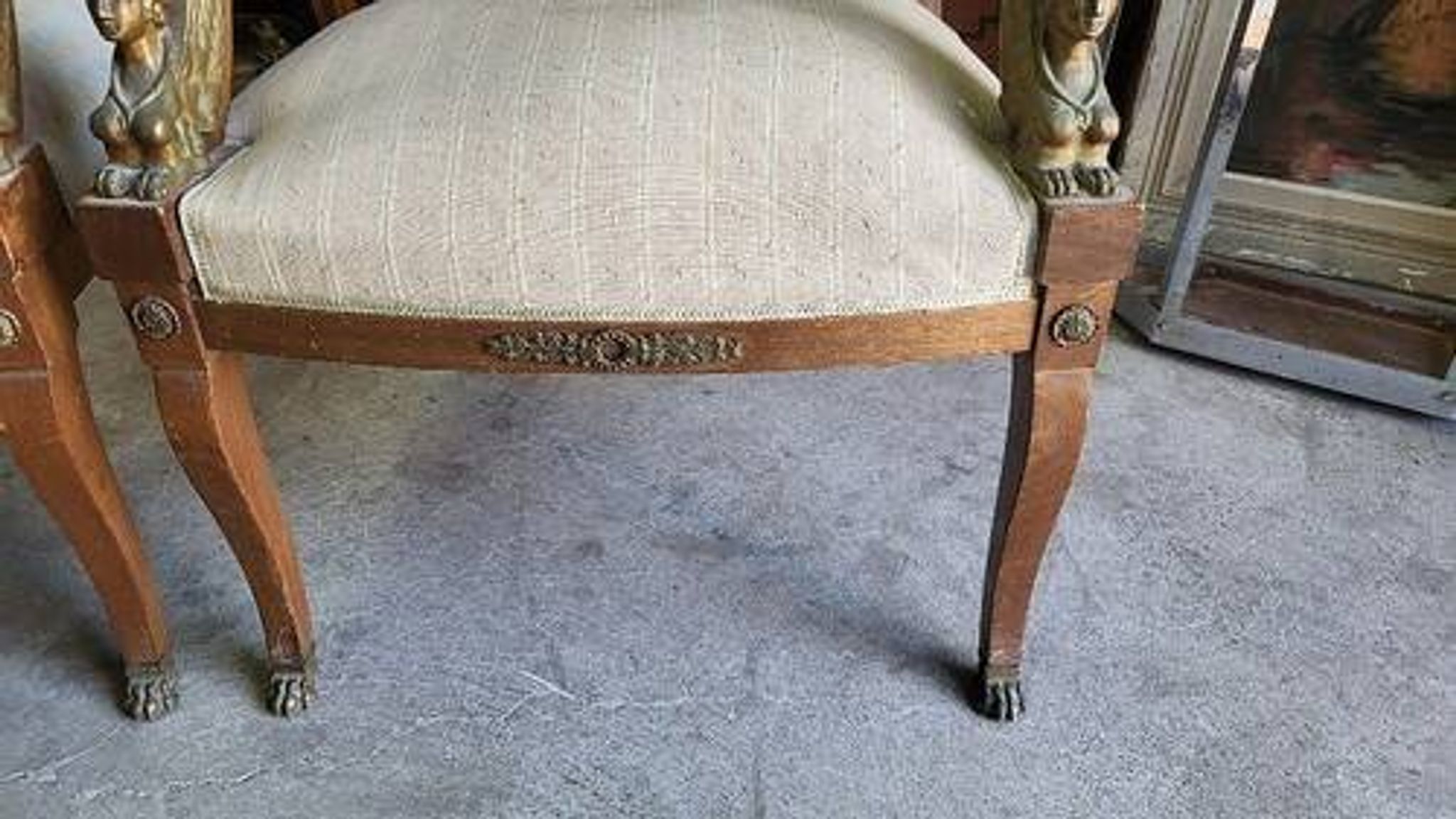 Pair of walnut armchairs in Empire style, Egyptian revival.