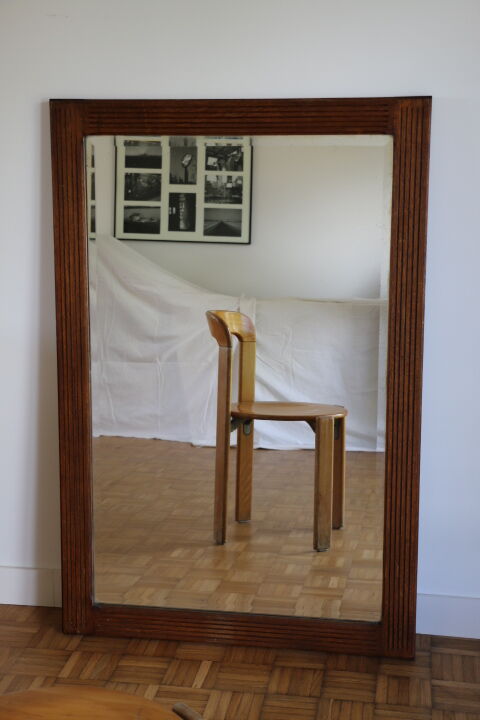 Beveled mirror grooved wood