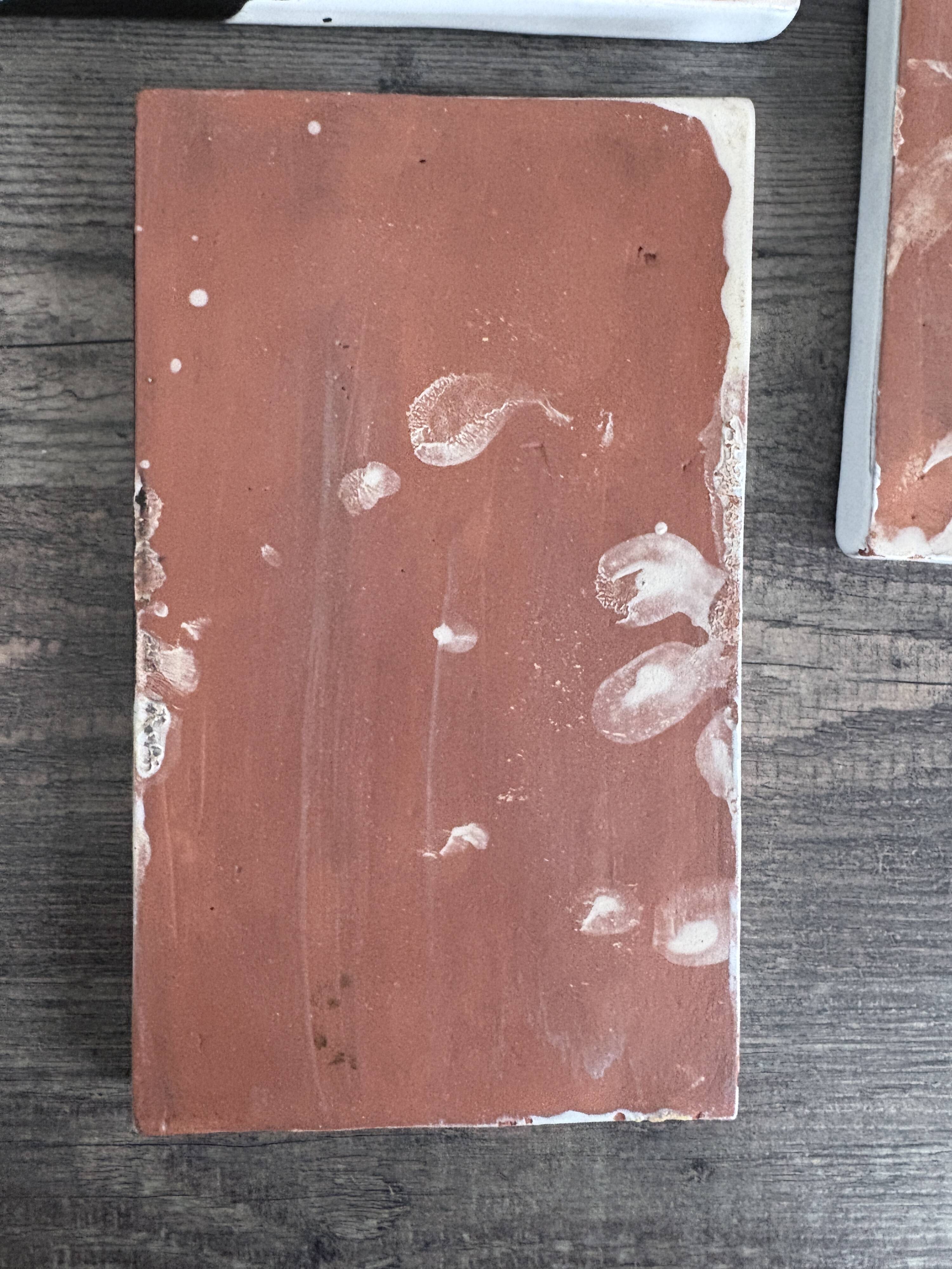 Lot of 4 rectangular glazed terracotta plates.