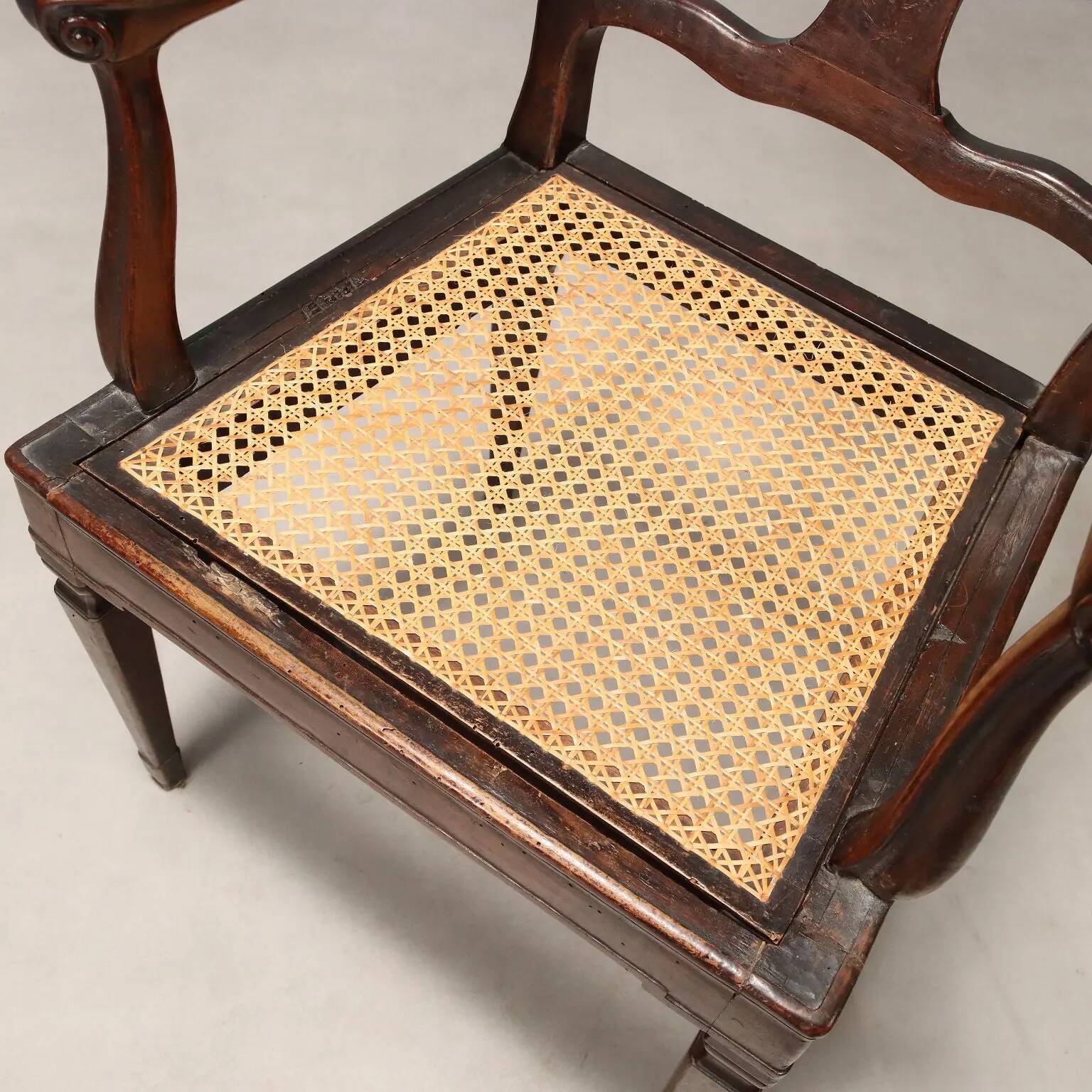 Antique walnut armchair with caned seat, Italy, 18th century