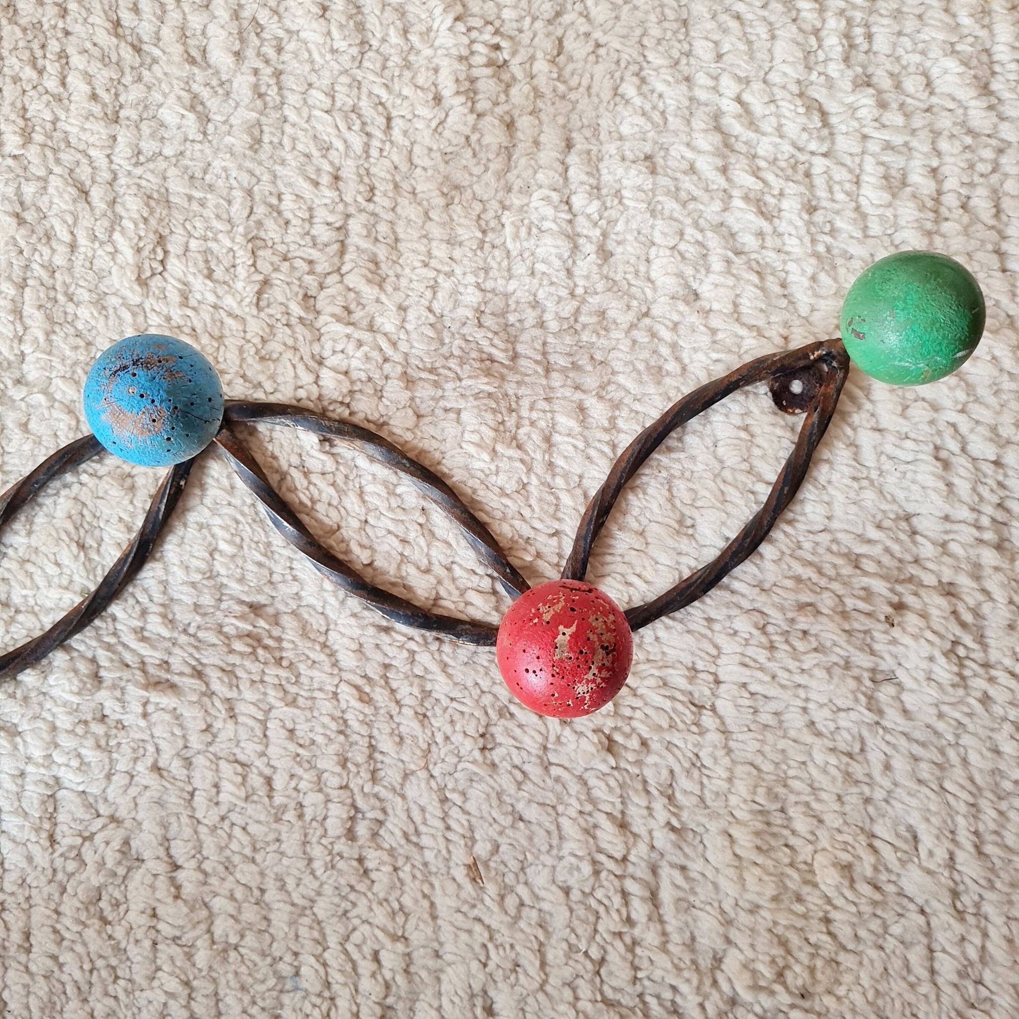 Vintage wall-mounted coat rack in wrought iron with coloured balls - Roger Feraud