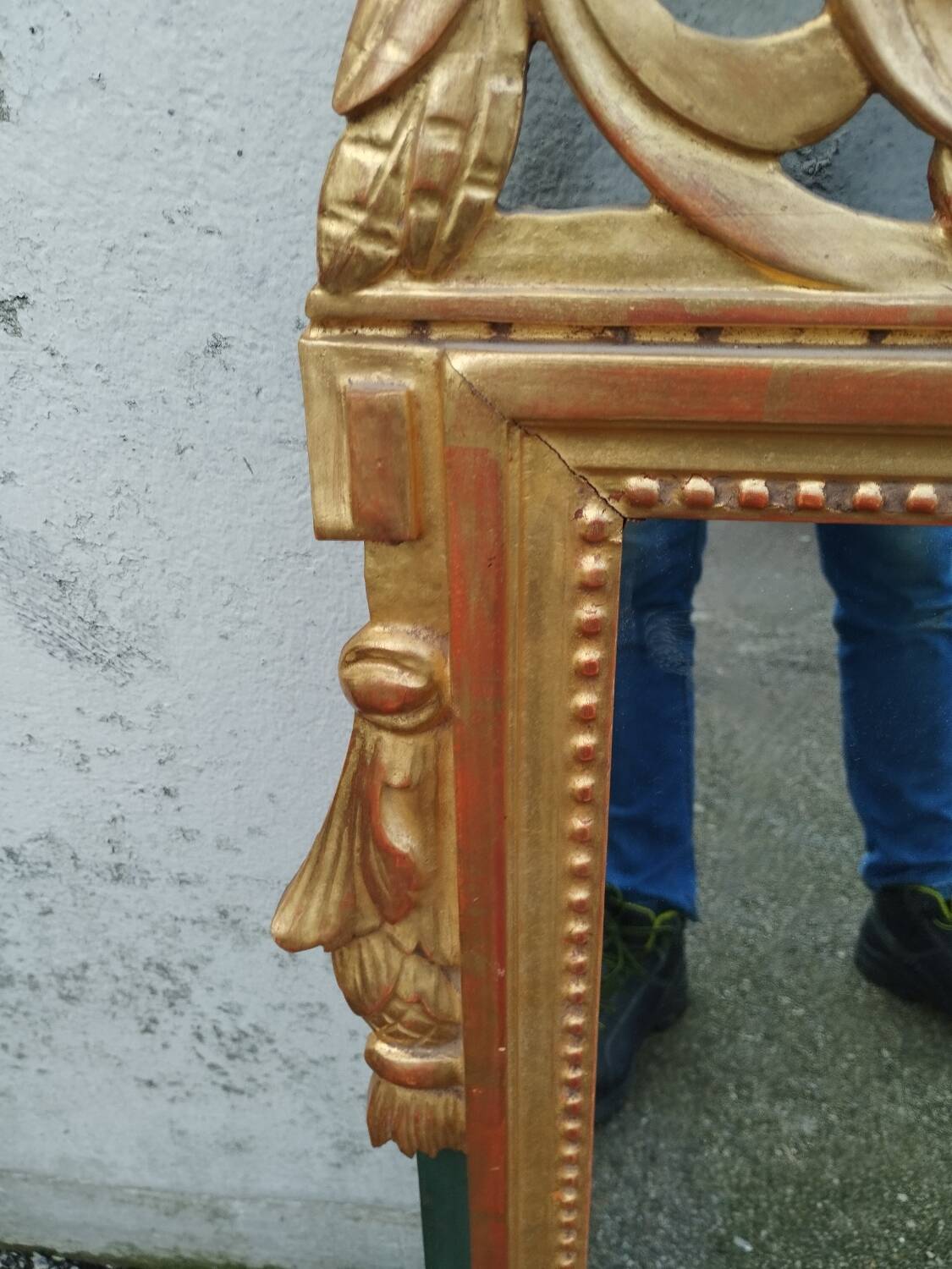 Antique gilded wooden mirror in Louis XVI style