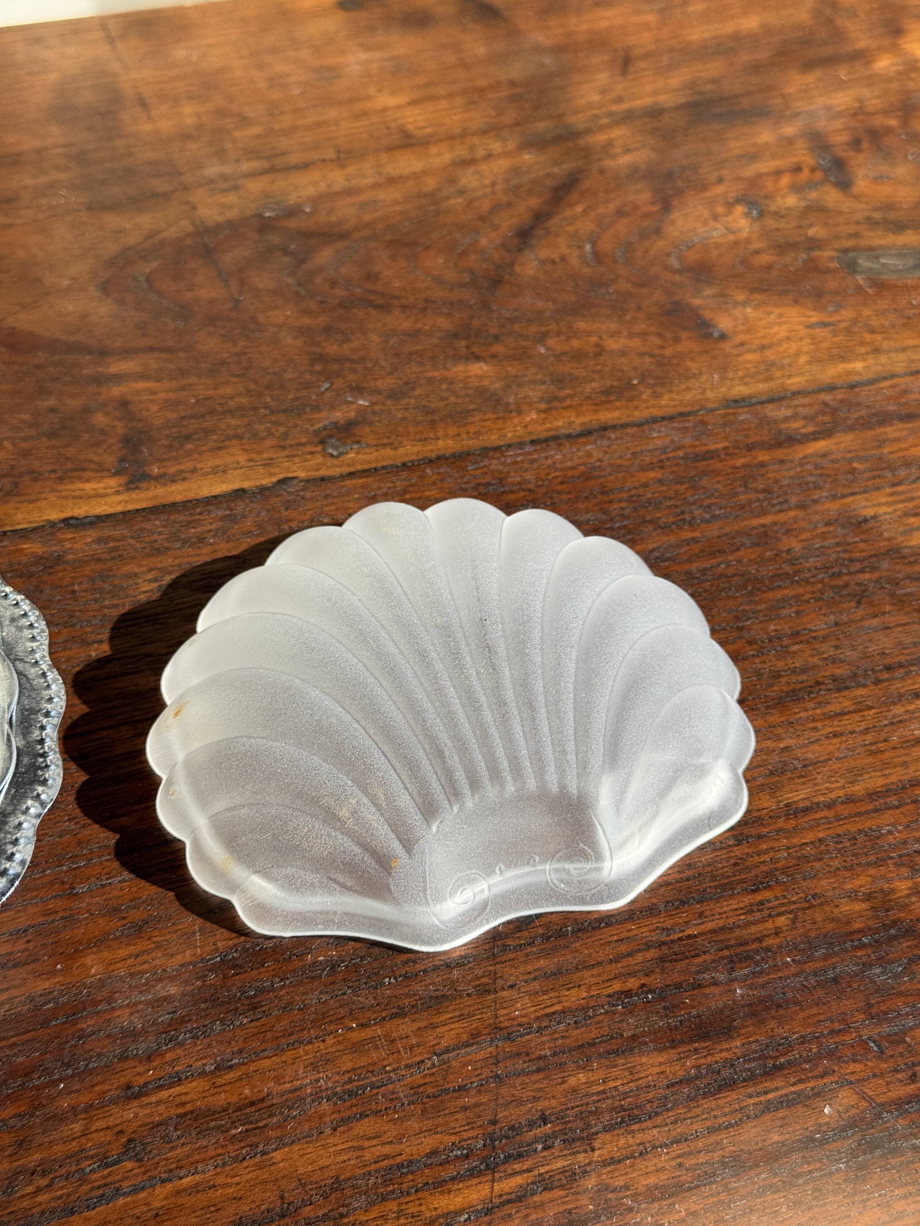 Vintage silver-plated shell butter dish with transparent bowl.