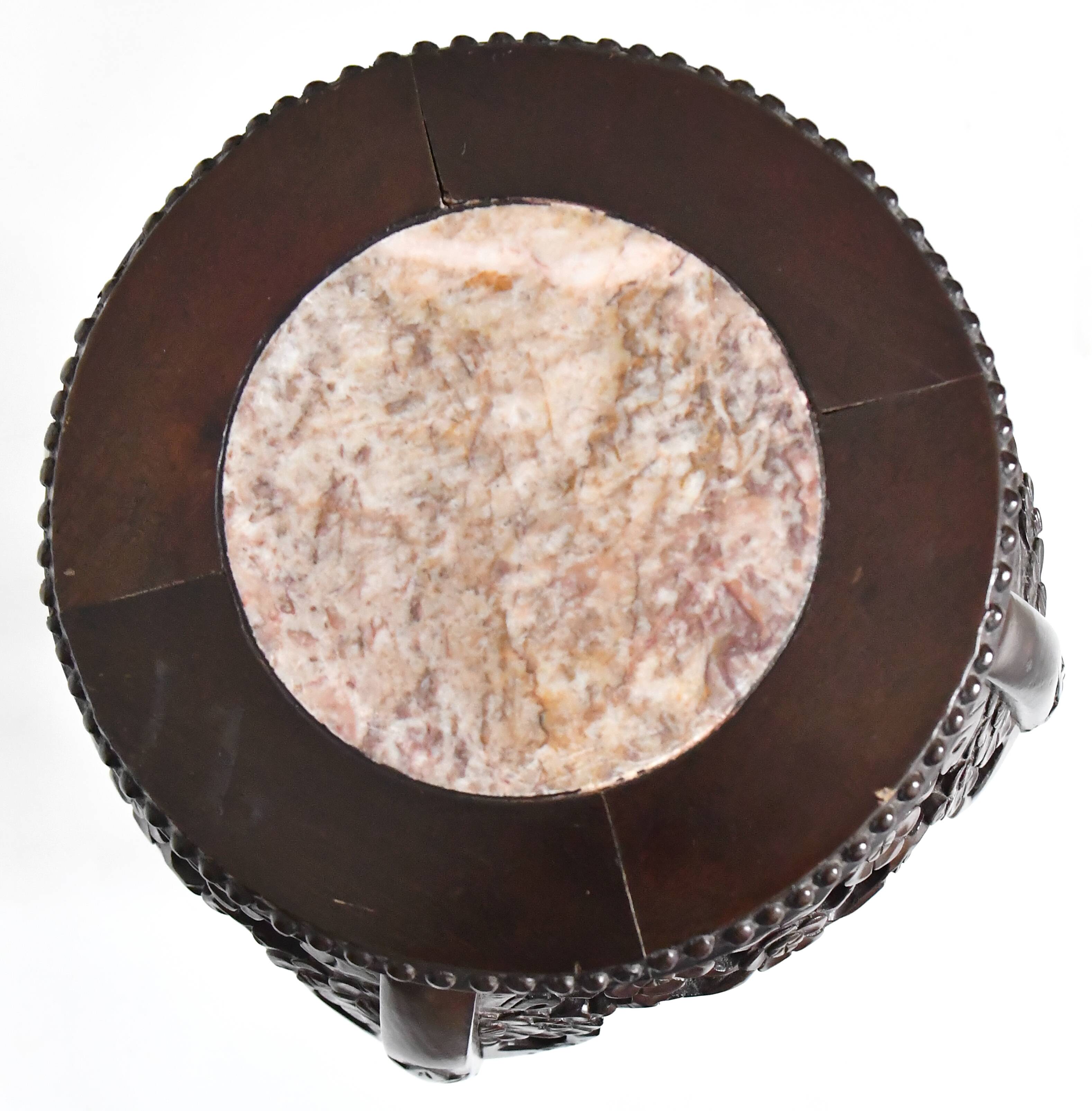 Chinese harness in richly carved wood and marble top
