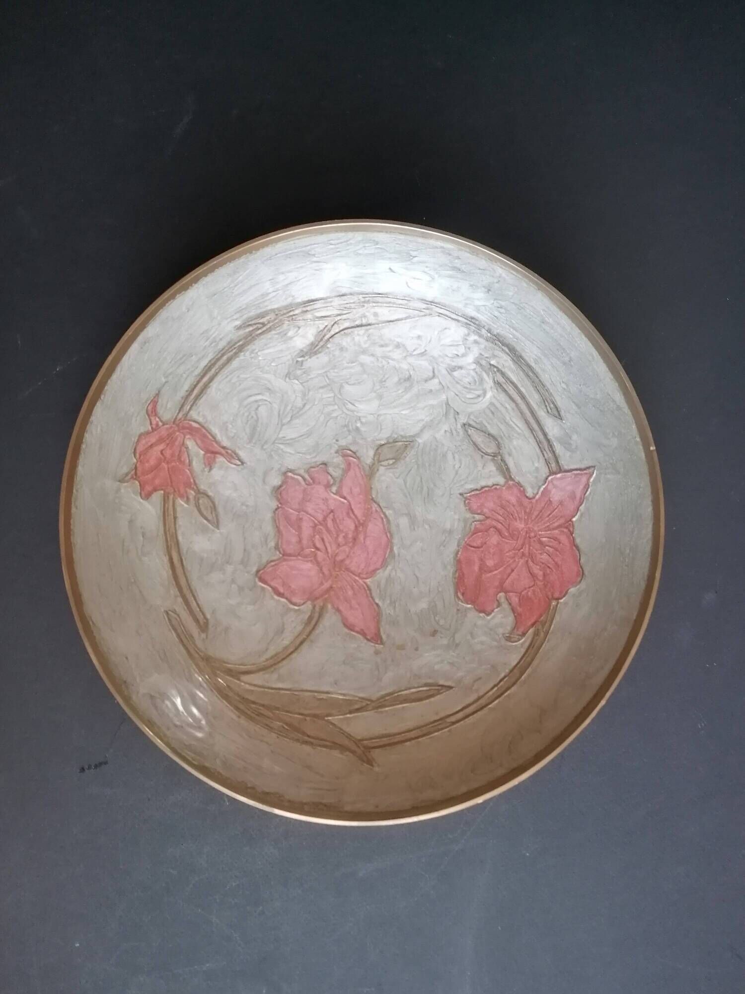Enamelled brass stand with floral decoration.