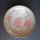 Enamelled brass stand with floral decoration.