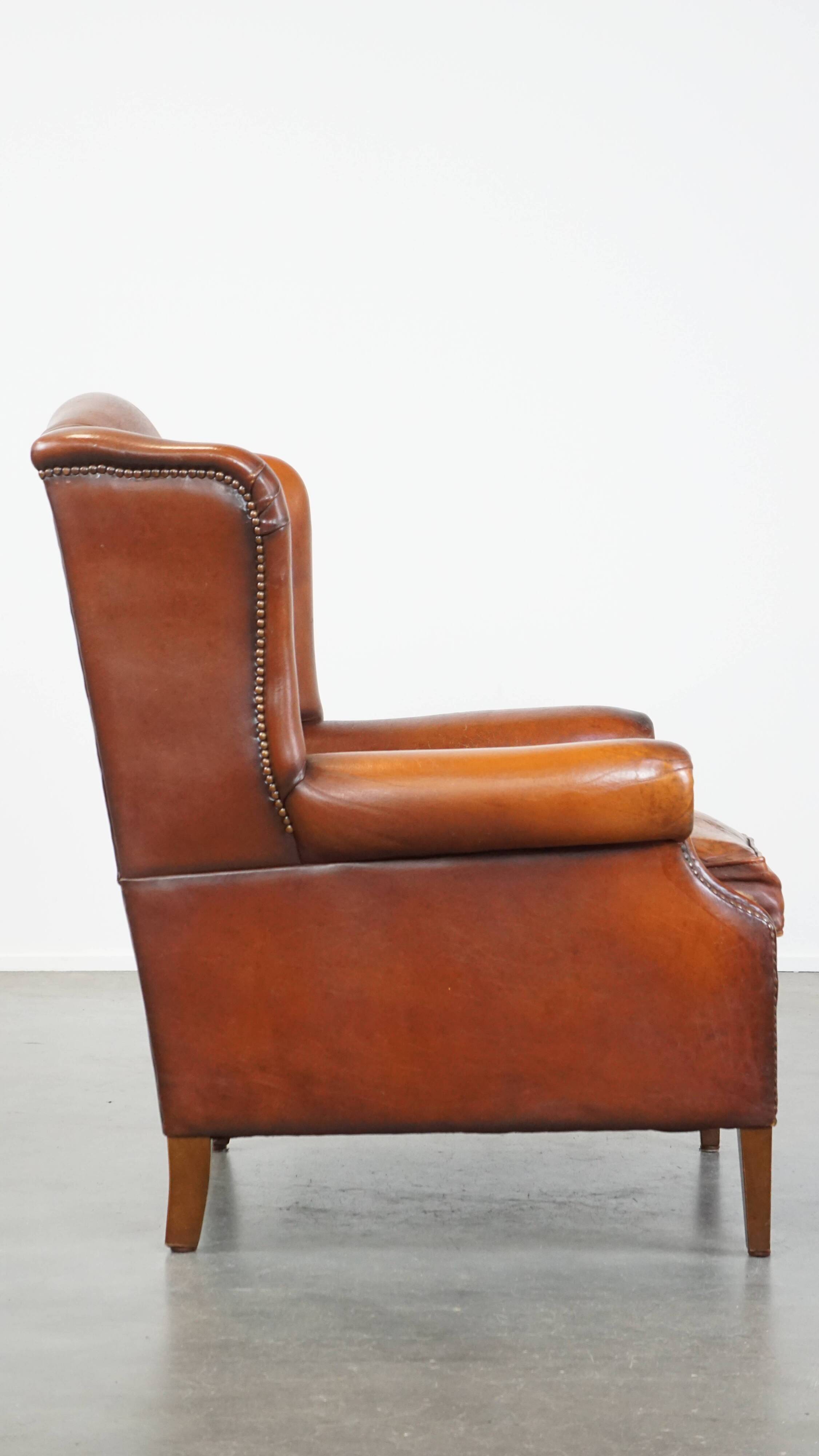 Sheepskin leather wingback chair with patina