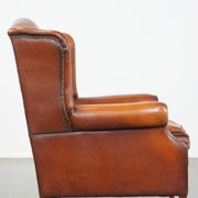 Sheepskin leather wingback chair with patina