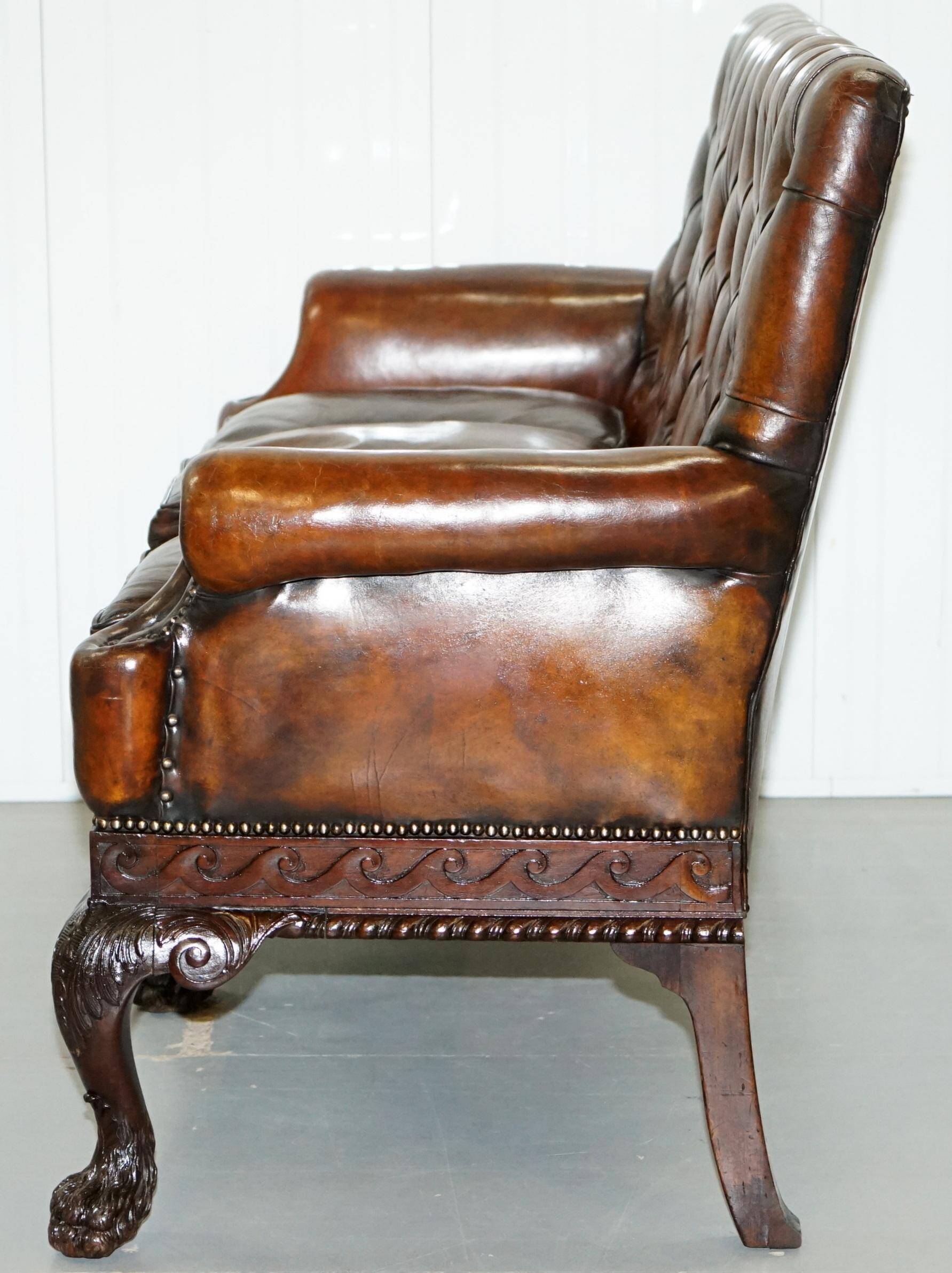 Chesterfield leather canapé in Georgian style with lion paw carved feet.