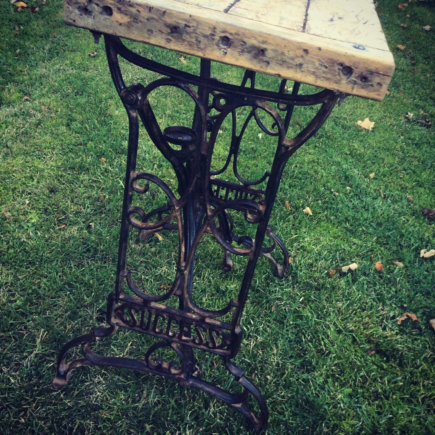 Established solid wood and cast iron console