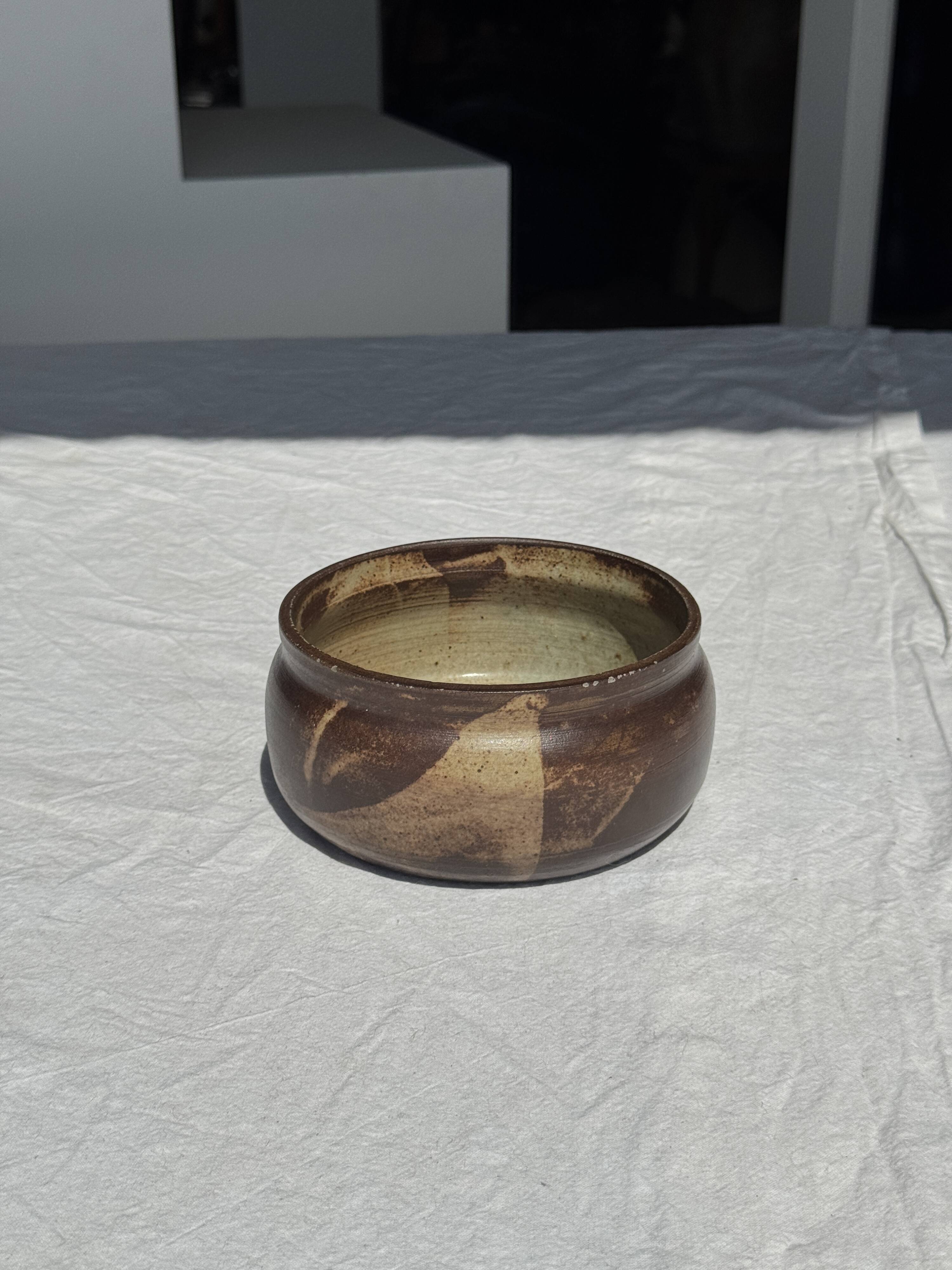 A small stoneware bowl, brown exterior, speckled grey interior D15