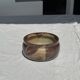 A small stoneware bowl, brown exterior, speckled grey interior D15