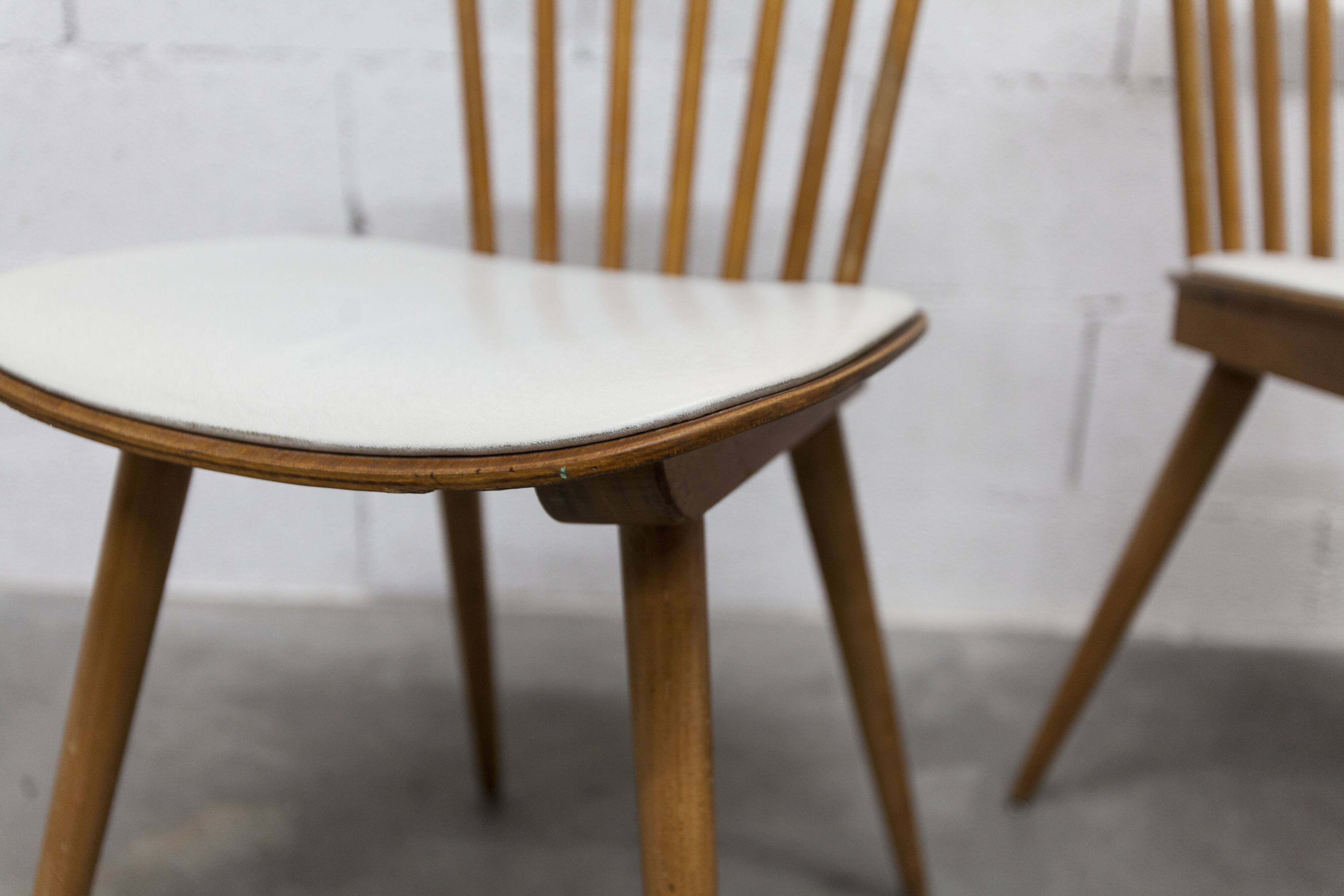 Pair of Baumann Menuet chairs, Honey patina, White vinyl seats