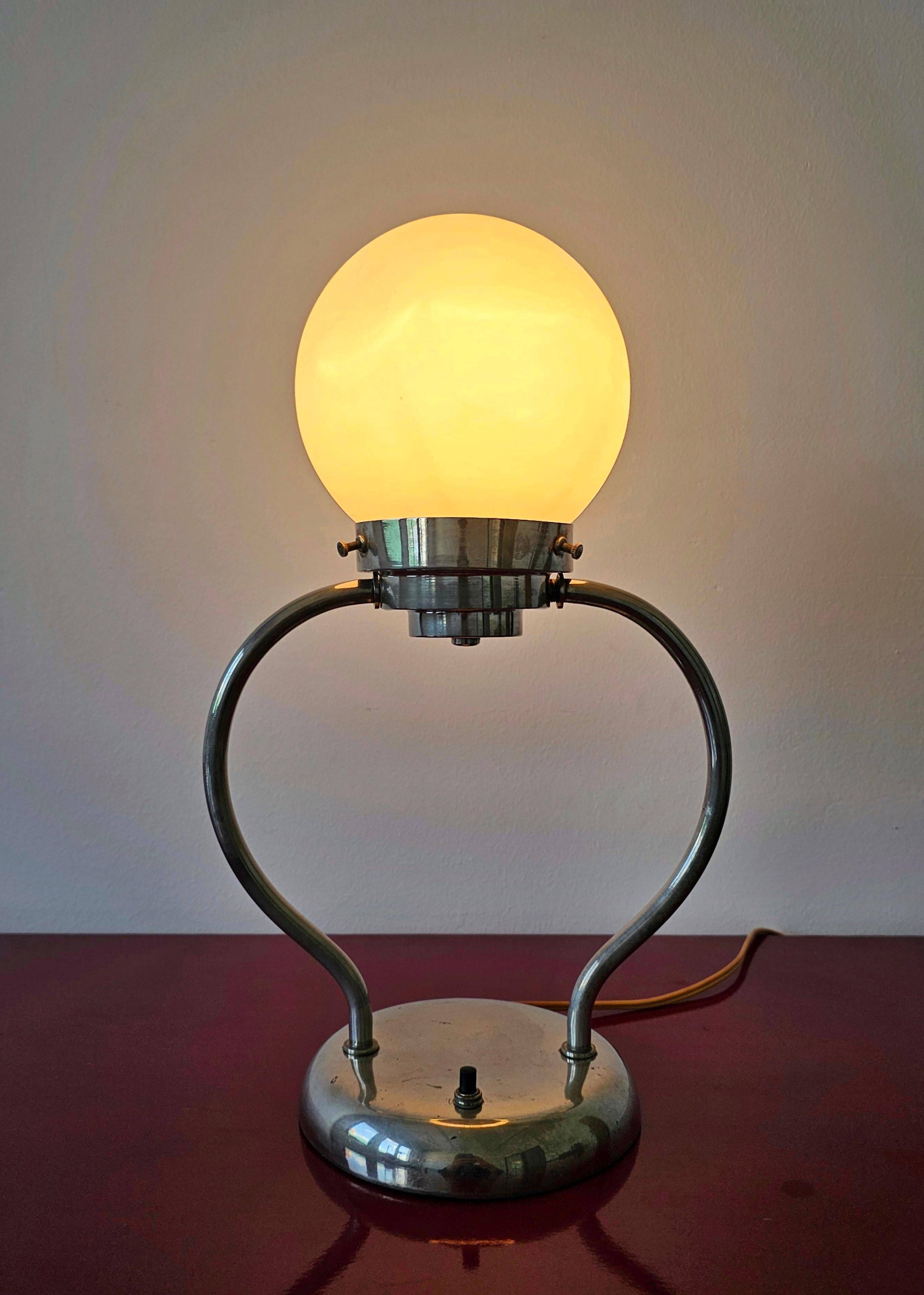 Art Deco table lamp with a spherical opaline glass shade and chrome base from the 1930s.