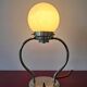 Art Deco table lamp with a spherical opaline glass shade and chrome base from the 1930s.