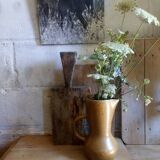 Vintage pitcher with enamelled earth cove