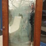 Art Deco door mirror with floral pattern frame