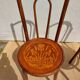 pair of bistro chairs, curved wood and pattern on the seat