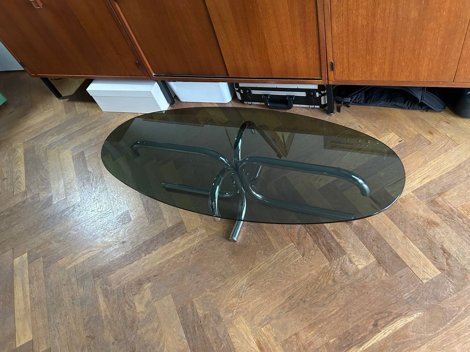 70s design oval coffee table in smoked black glass with chrome legs.