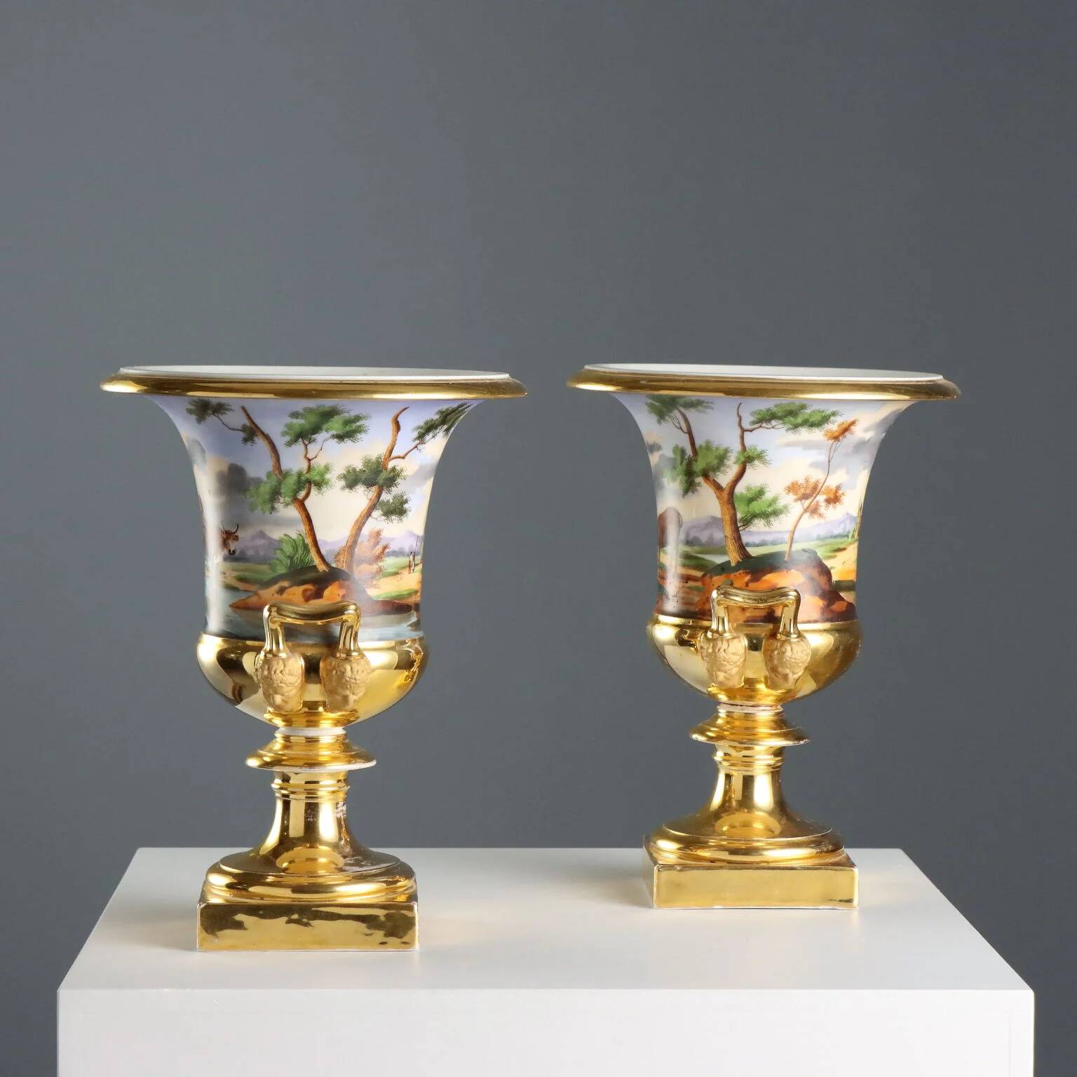 Pair of antique painted and decorated porcelain vases, France, 19th century.