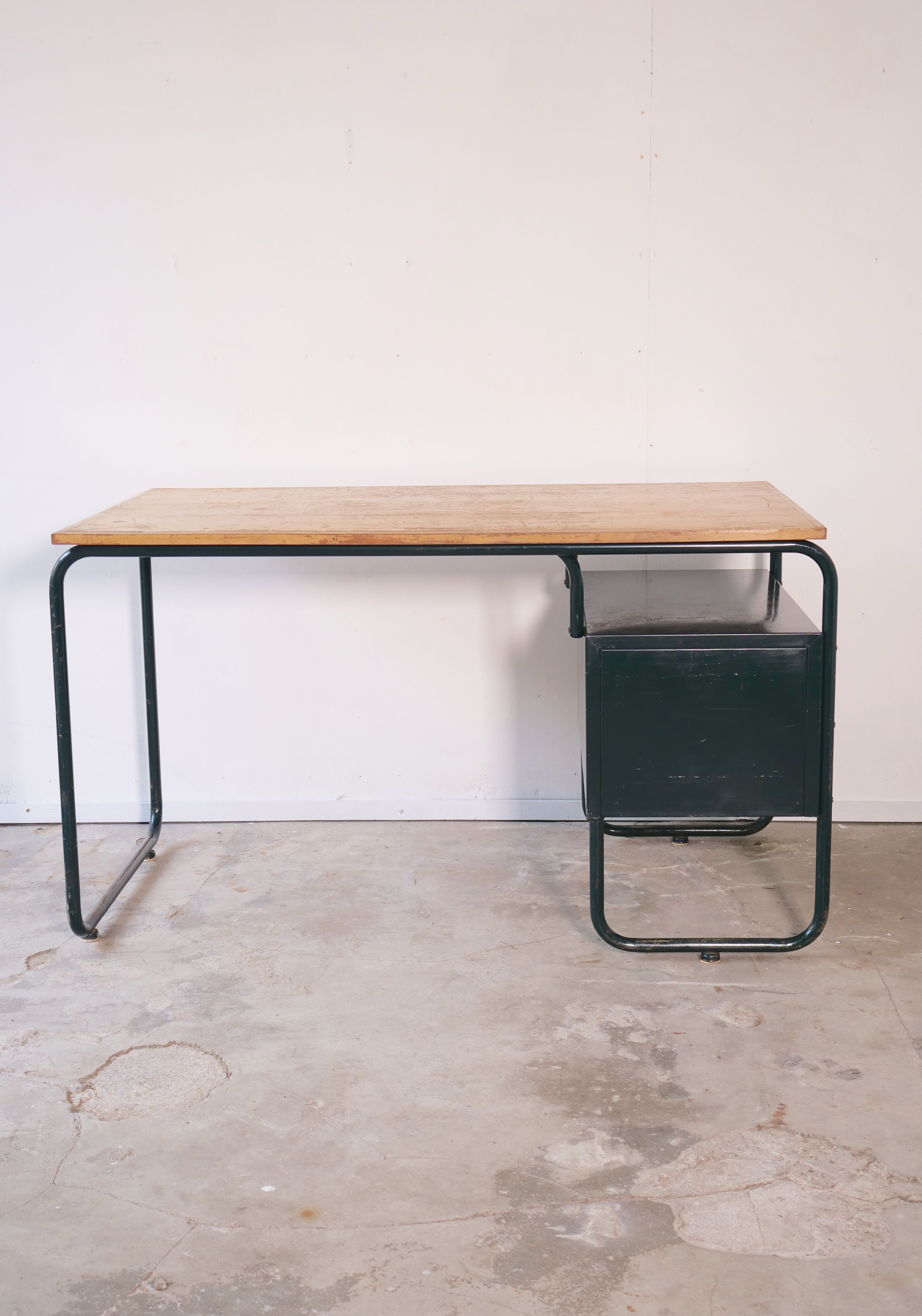 Desk with bauhaus style tubular steel chair