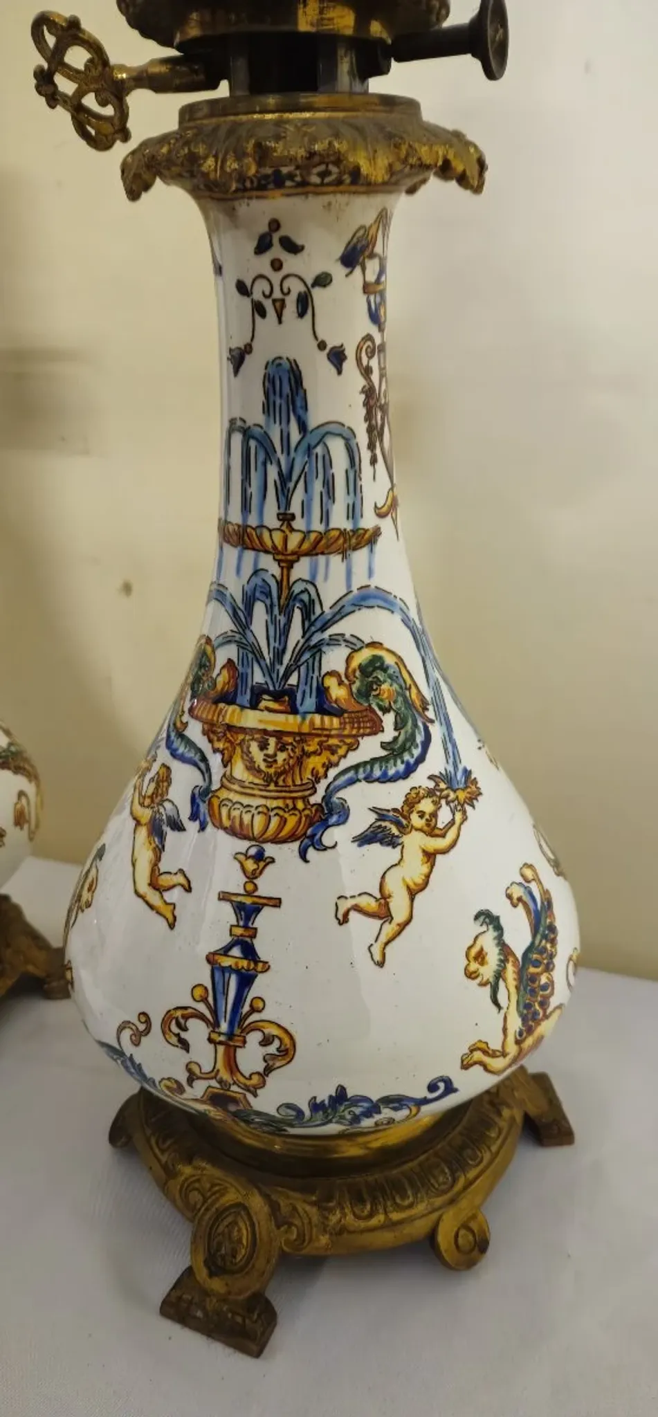 Gien: pair of antique oil lamps in fine earthenware richly decorated.