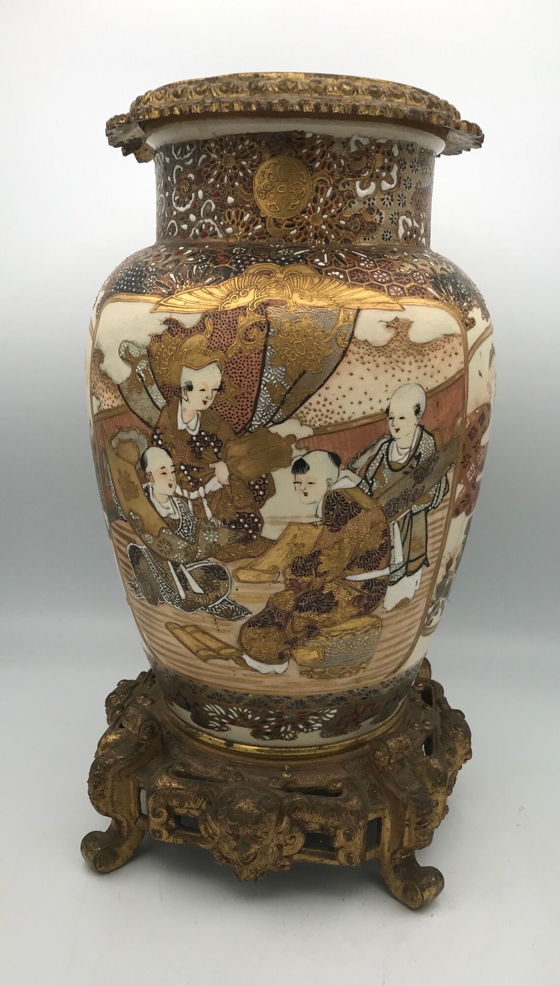 Old satsuma ceramic vase with various decorations mounted on bronze