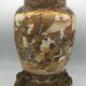 Old satsuma ceramic vase with various decorations mounted on bronze