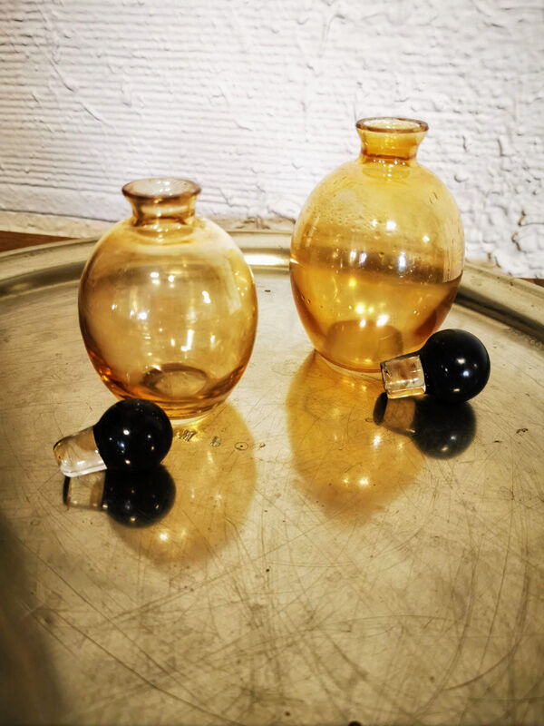 Duo of small amber bottles