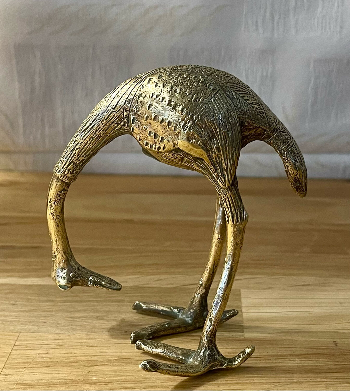 Heron in brass.