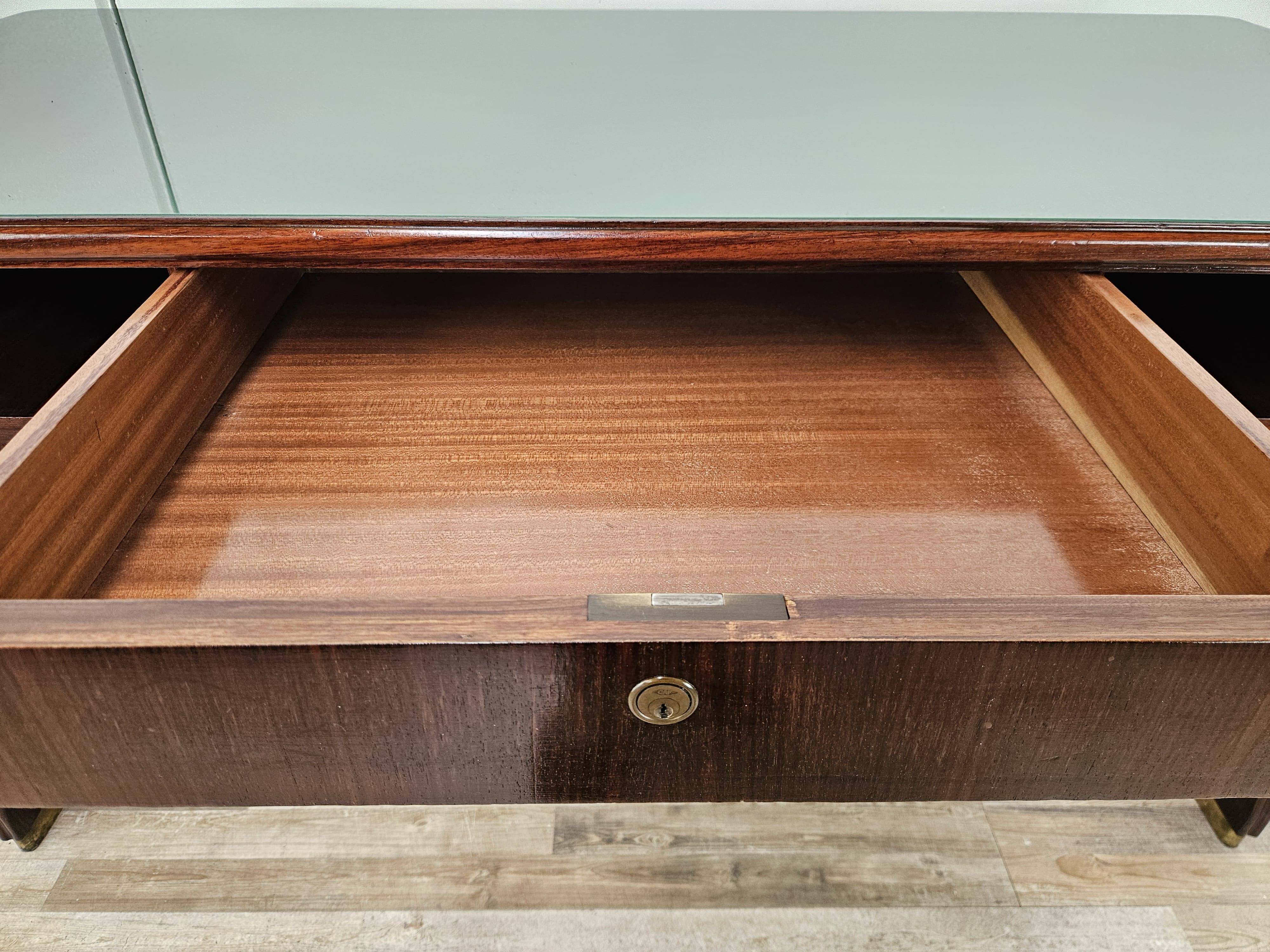 Executive Art Decò desk in exotic wood, glass, and brass