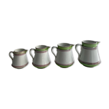 Series of 4 small pitchers.