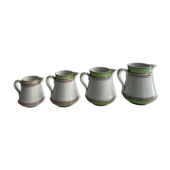Series of 4 small pitchers.