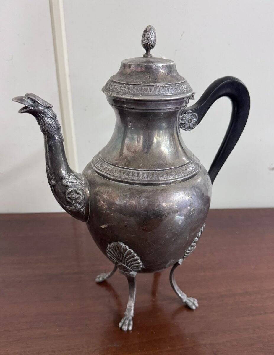 Empire style silver-plated verseuse, resting on three sculpted feet.