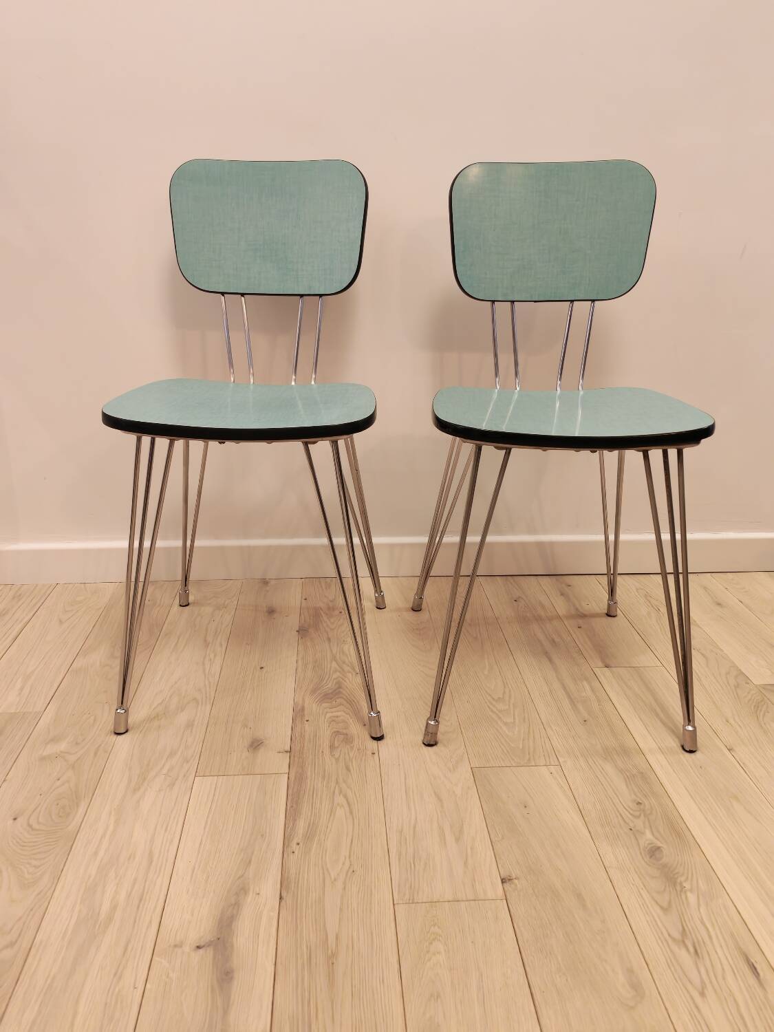 Pair of green Formica chairs with Eiffel legs
