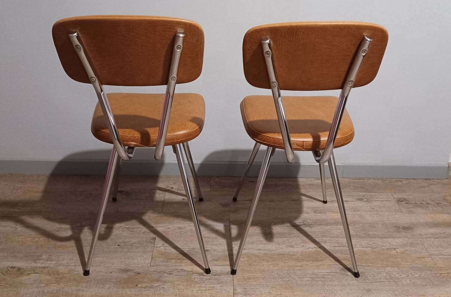 Pair of vintage faux leather and chrome chairs