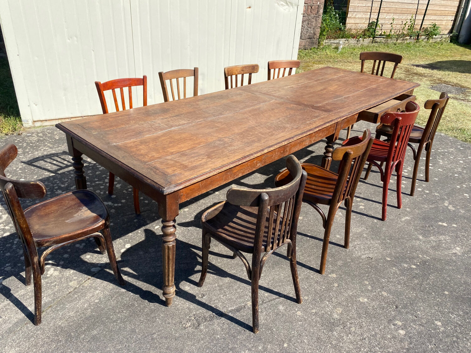 Draper table and its 10 chairs