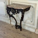 Console Louis XV en chêne sculpté, patine noire, XVIIIeme siècle