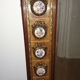 Mirror in gilded bronze and mahogany wood Medallion porcelain decoration.