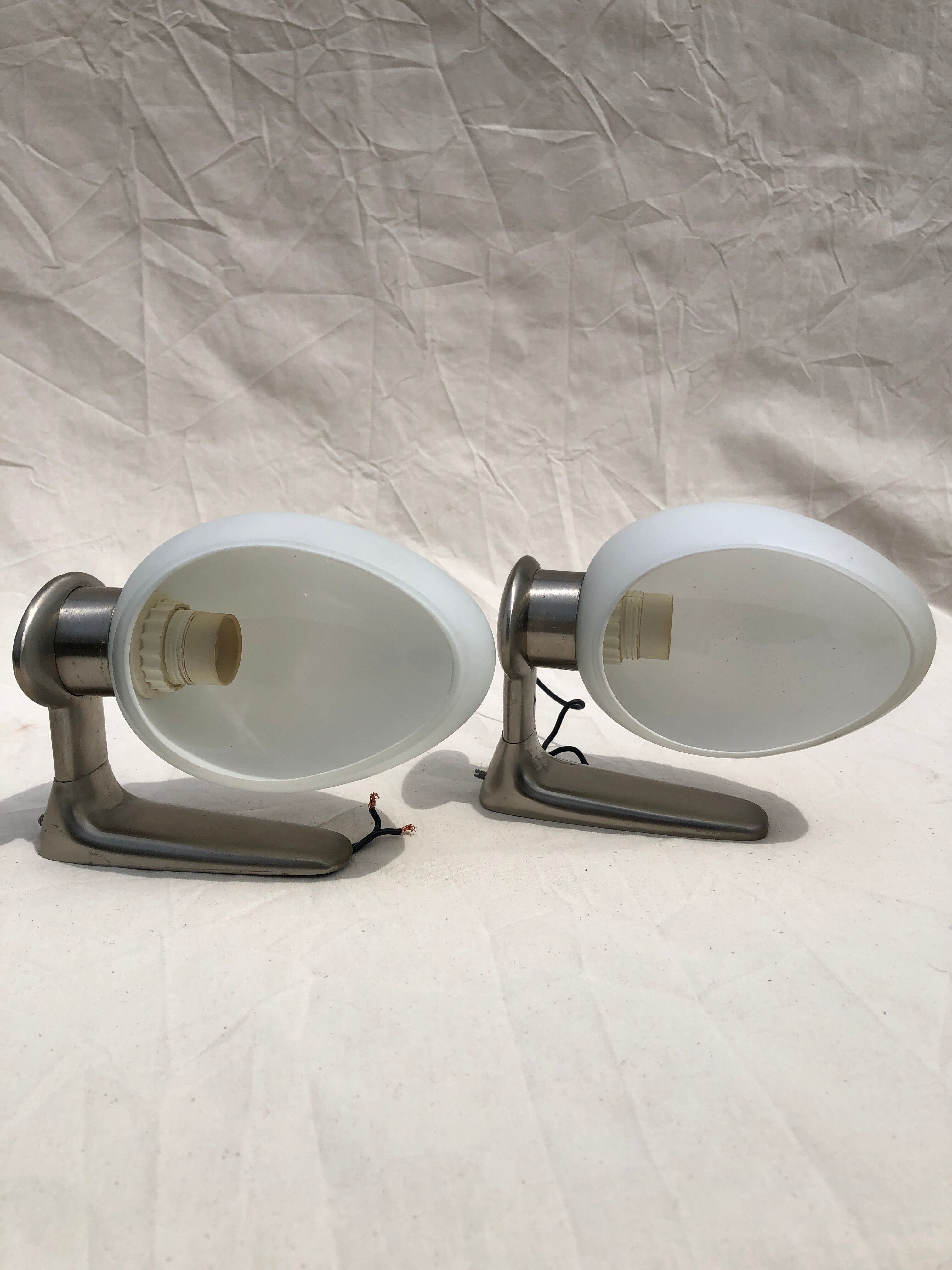 Pair of brushed steel appliques, half-egg opaline, 1970
