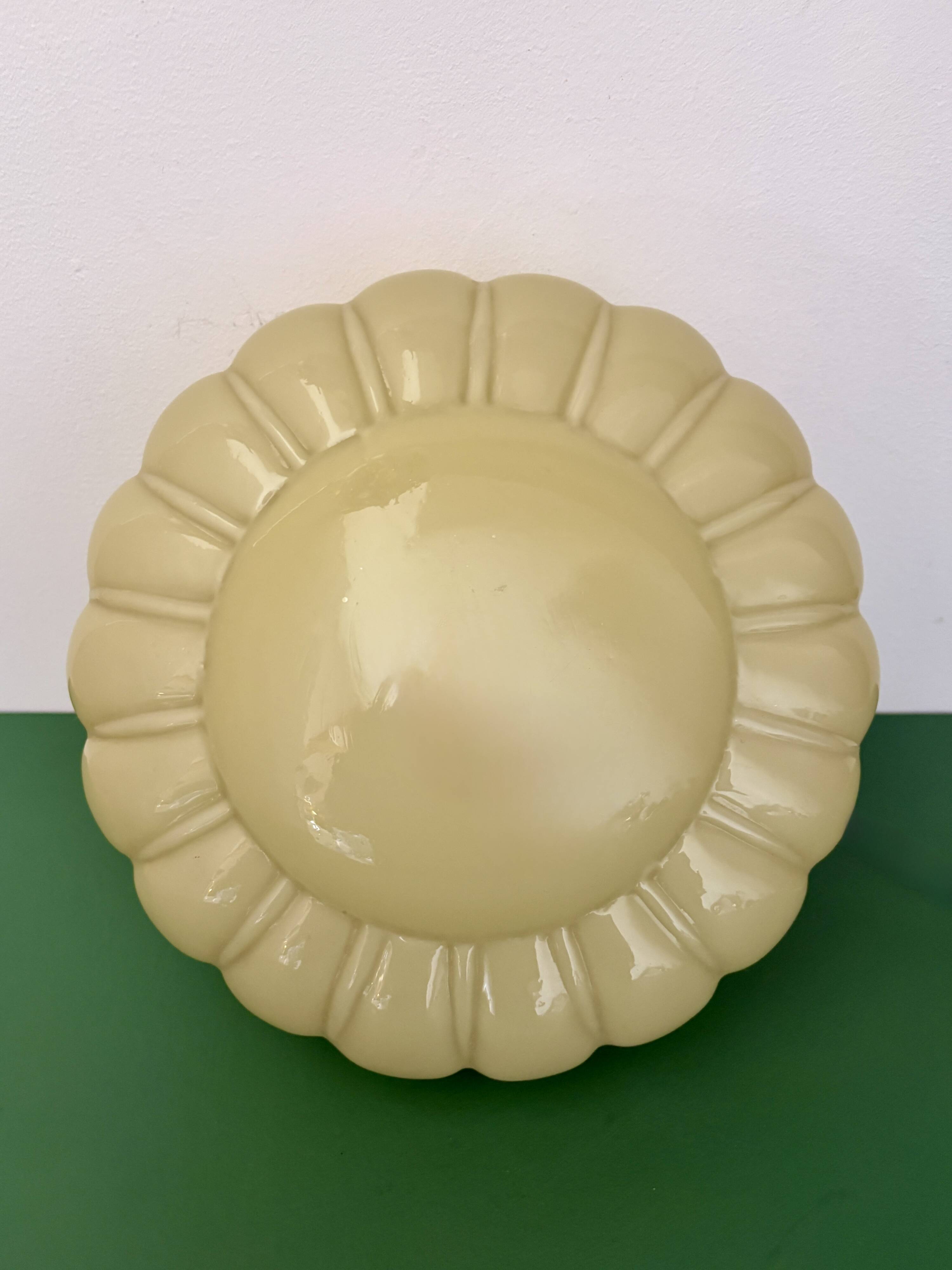 Vintage Art Deco globe wall or ceiling light in yellow opaline.