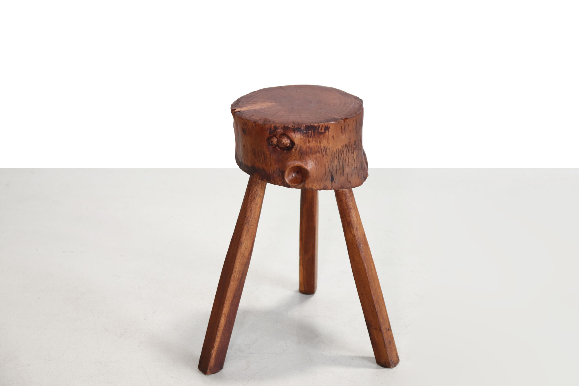 French brutalist tree trunk stools