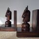 Pair of vintage wooden bookends with stylised horse heads.